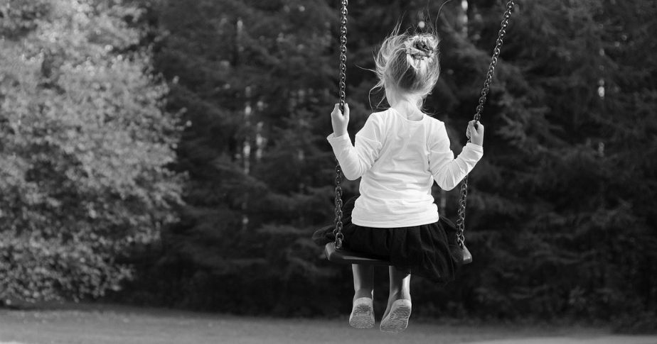 young girl on a swing