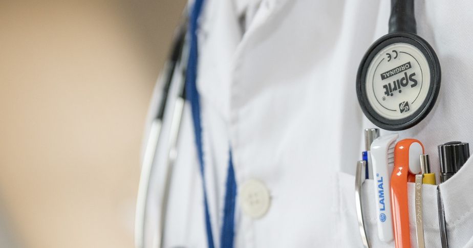 pocket of medical doctor showing pens and stethescope