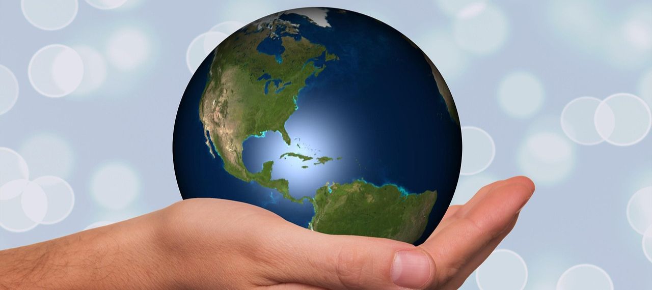 Holding globe-Image by Gerd Altmann from Pixabay