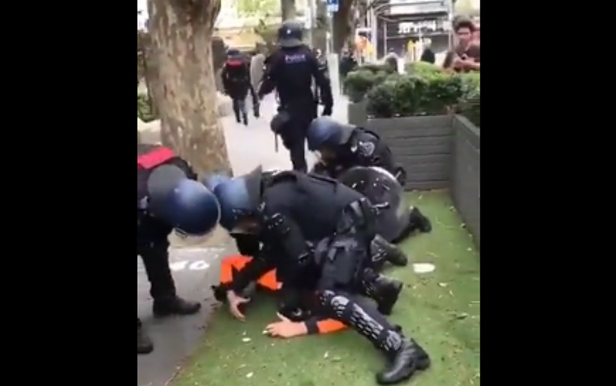 police tackle man