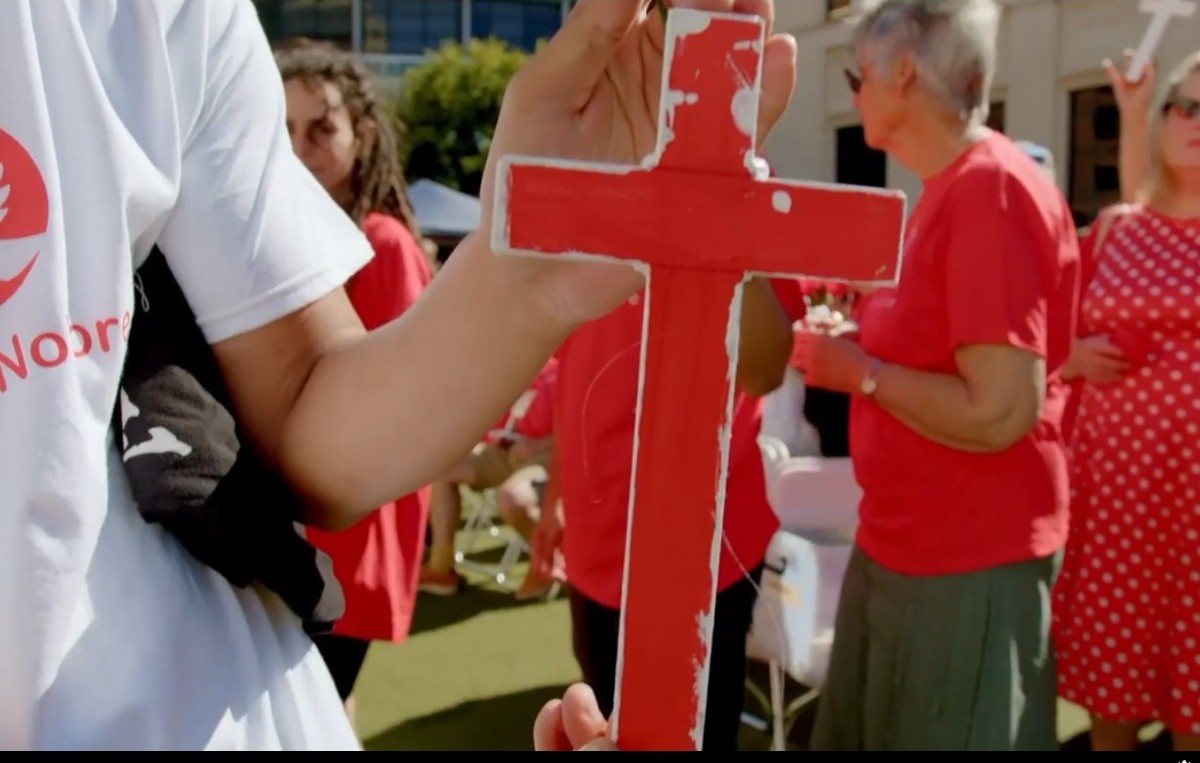 several_people_and_red_and_white_cross