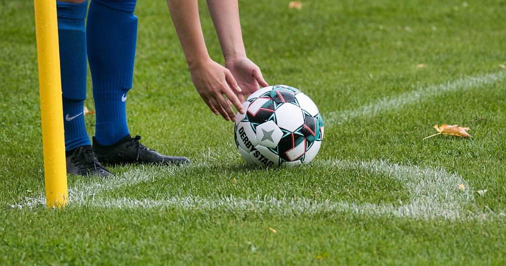 footballer placing the ball